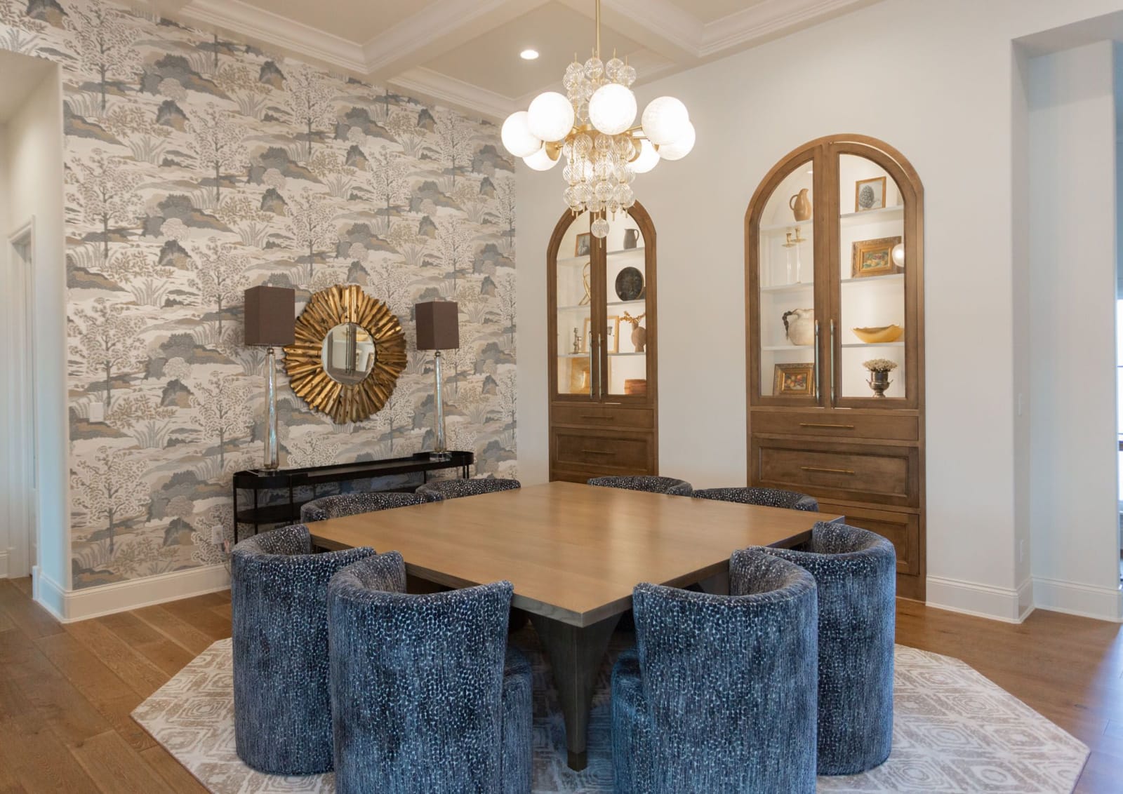 Built-in living room cabinetry with open shelving either side of a fireplace