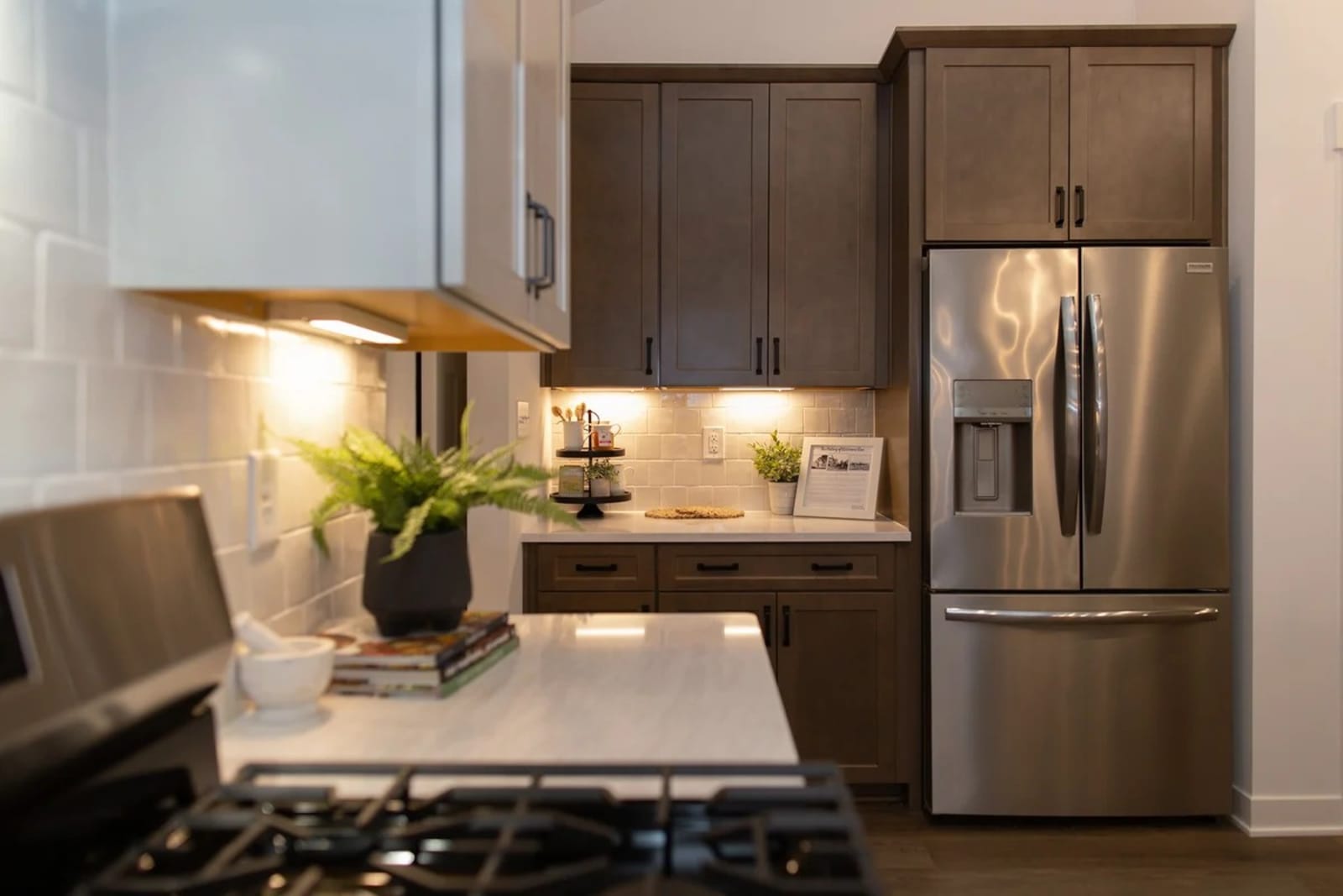 Open kitchen with island seating and pendant lighting above