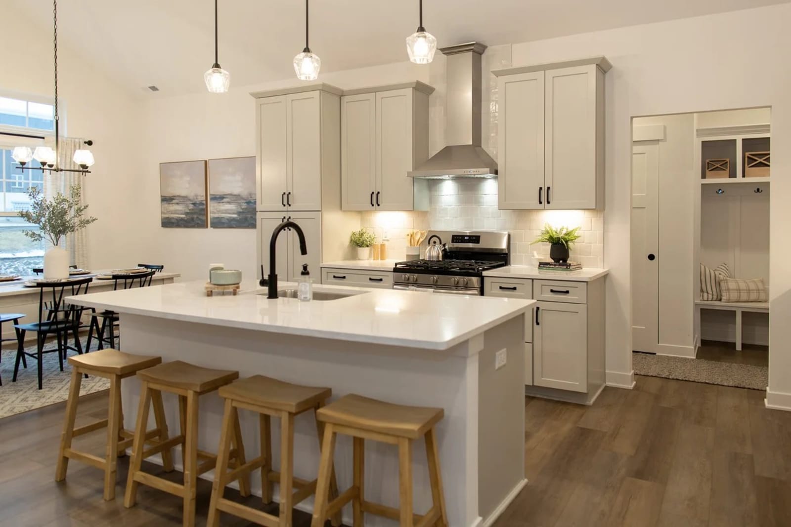 Kitchen island with a thick stone countertop and waterfall edge