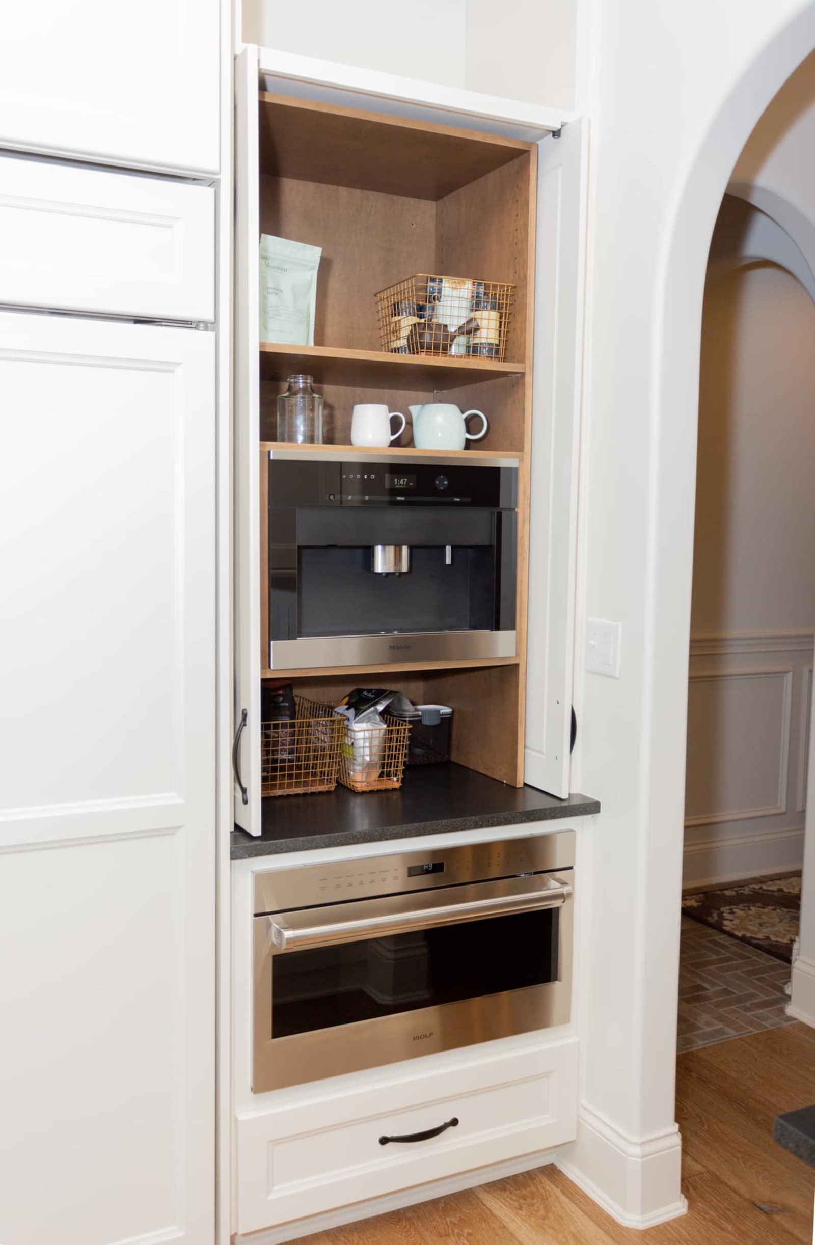 Fitted closet with hanging rails, drawer stacks and open shelving